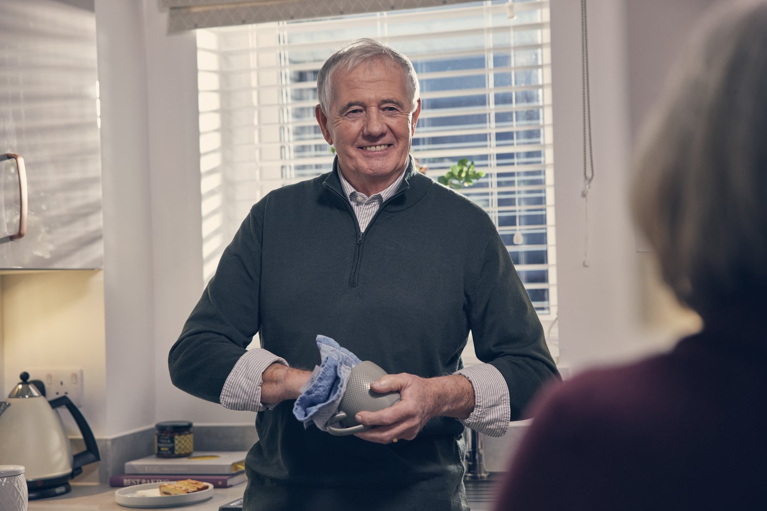 An elderly person moving to a brand retirement living development.
