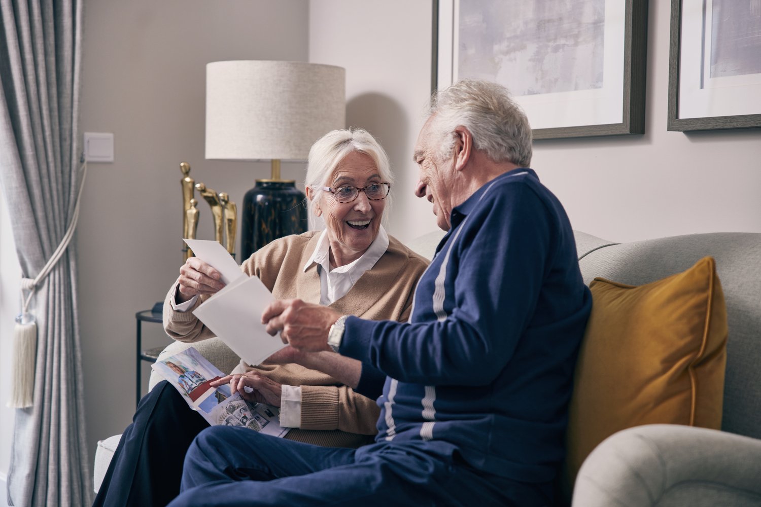An elderly couple preparing to move to a new retirement living development.