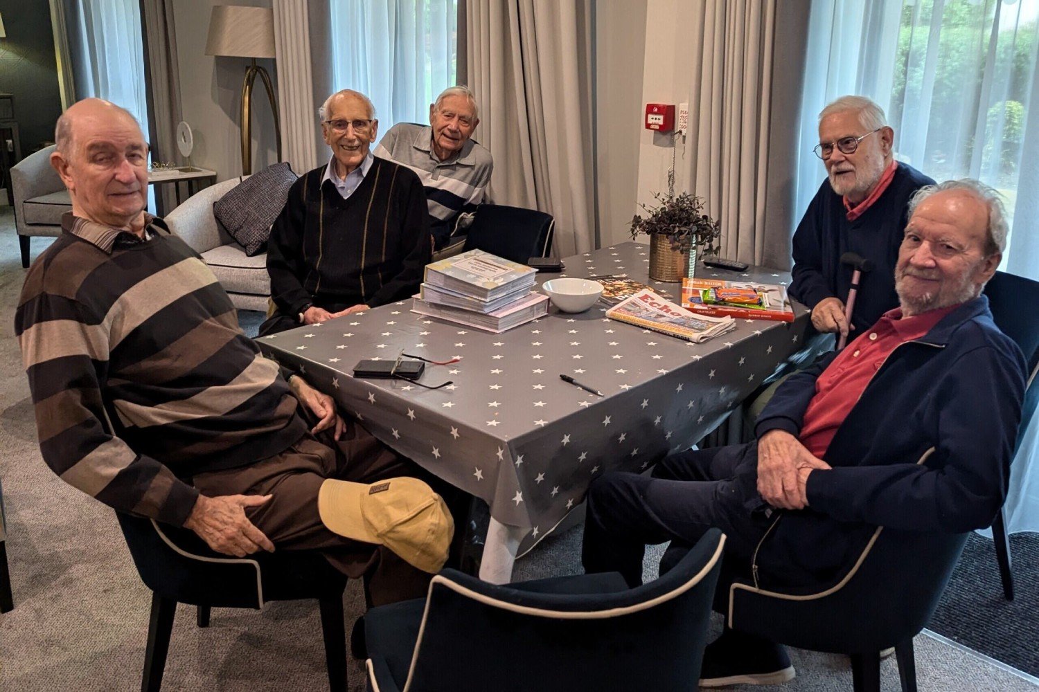 Senior men enjoying brunch, one of the retired men’s clubs at their McCarthy Stone retirement properties in Essex