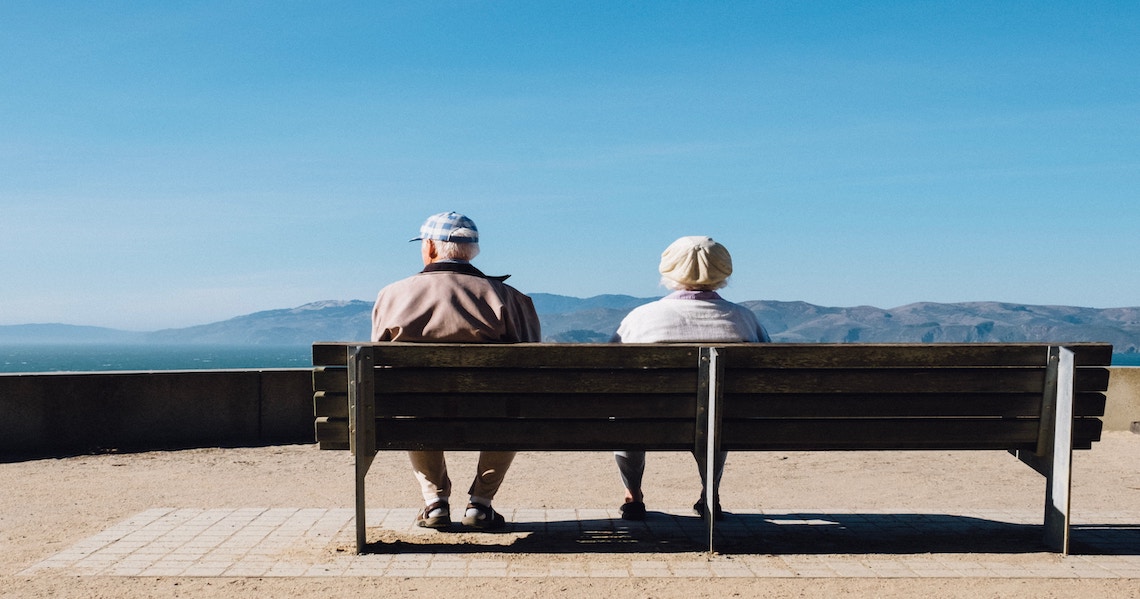 a couple sitting on a bench
