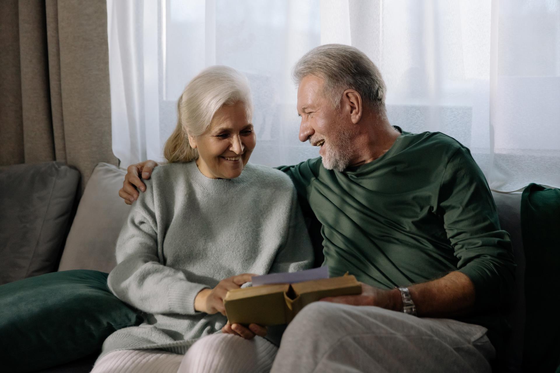 a man and woman sitting on a couch