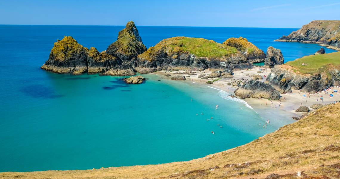 a beach with rocks and a body of water