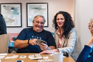 Simon and the House Manager Delia pictured enjoying card games at Stour Gate a retirement living community in Blandford Forum in Dorset.