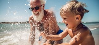 Granddad and grandchild by the seaside