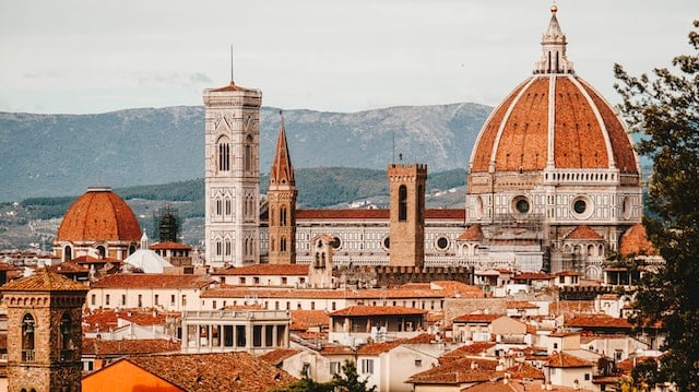 Florence Cathedral with a large building and a large dome with towers