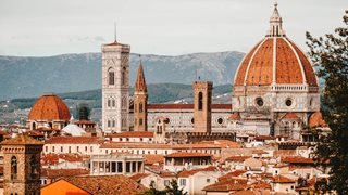 Florence Cathedral with a large building and a large dome with towers