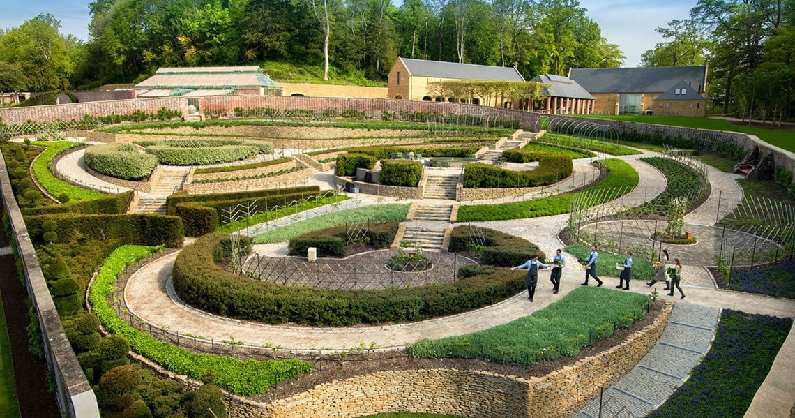 a garden with a group of people walking around it