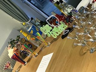 a table with glasses and bottles