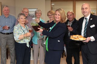a group of people holding food