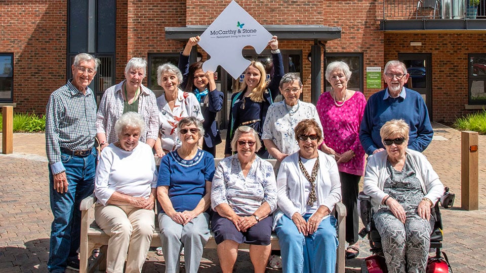 a group of people posing for a photo