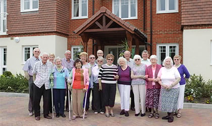 a group of people posing for a photo