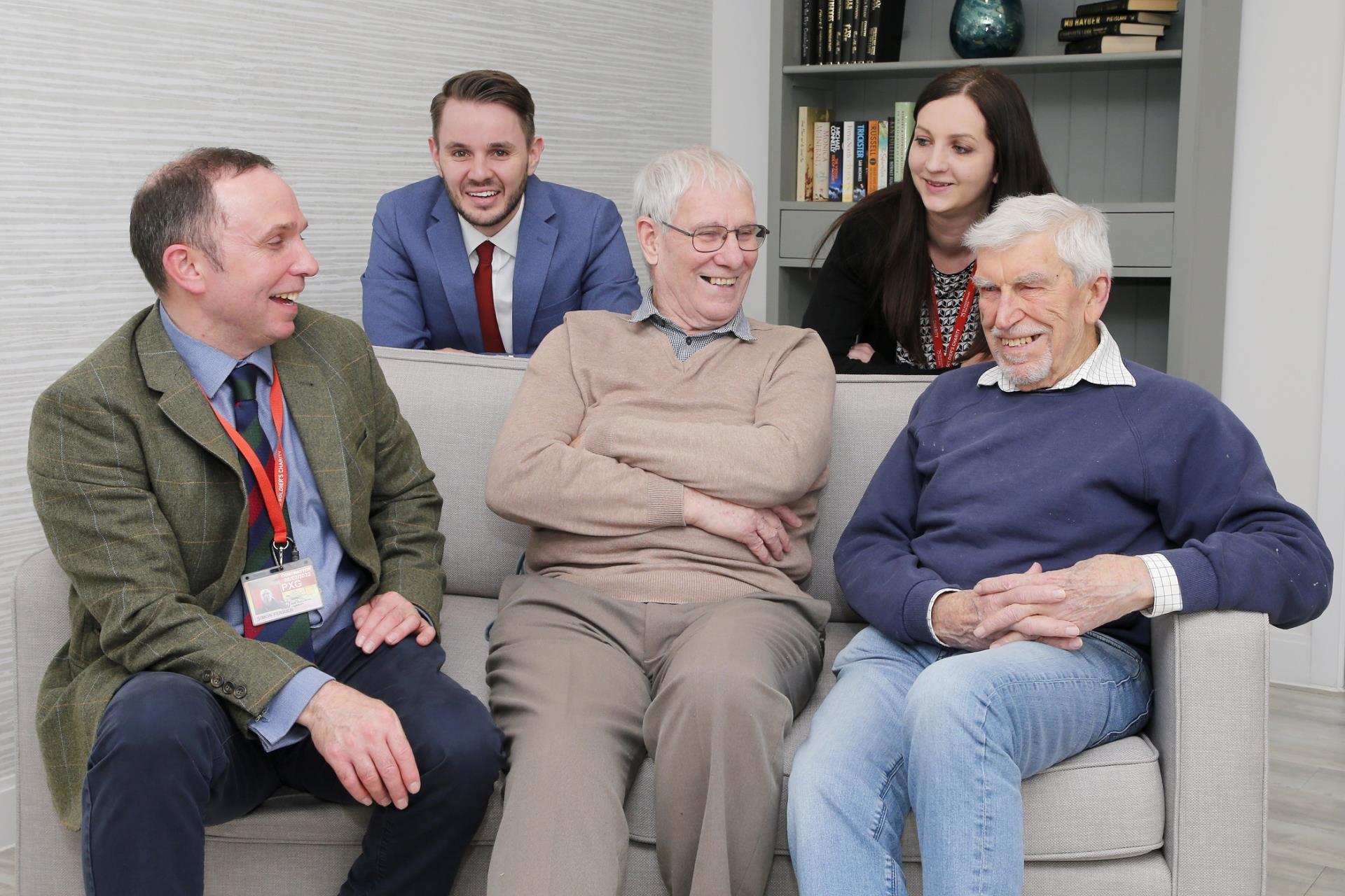 a group of people sitting on a couch