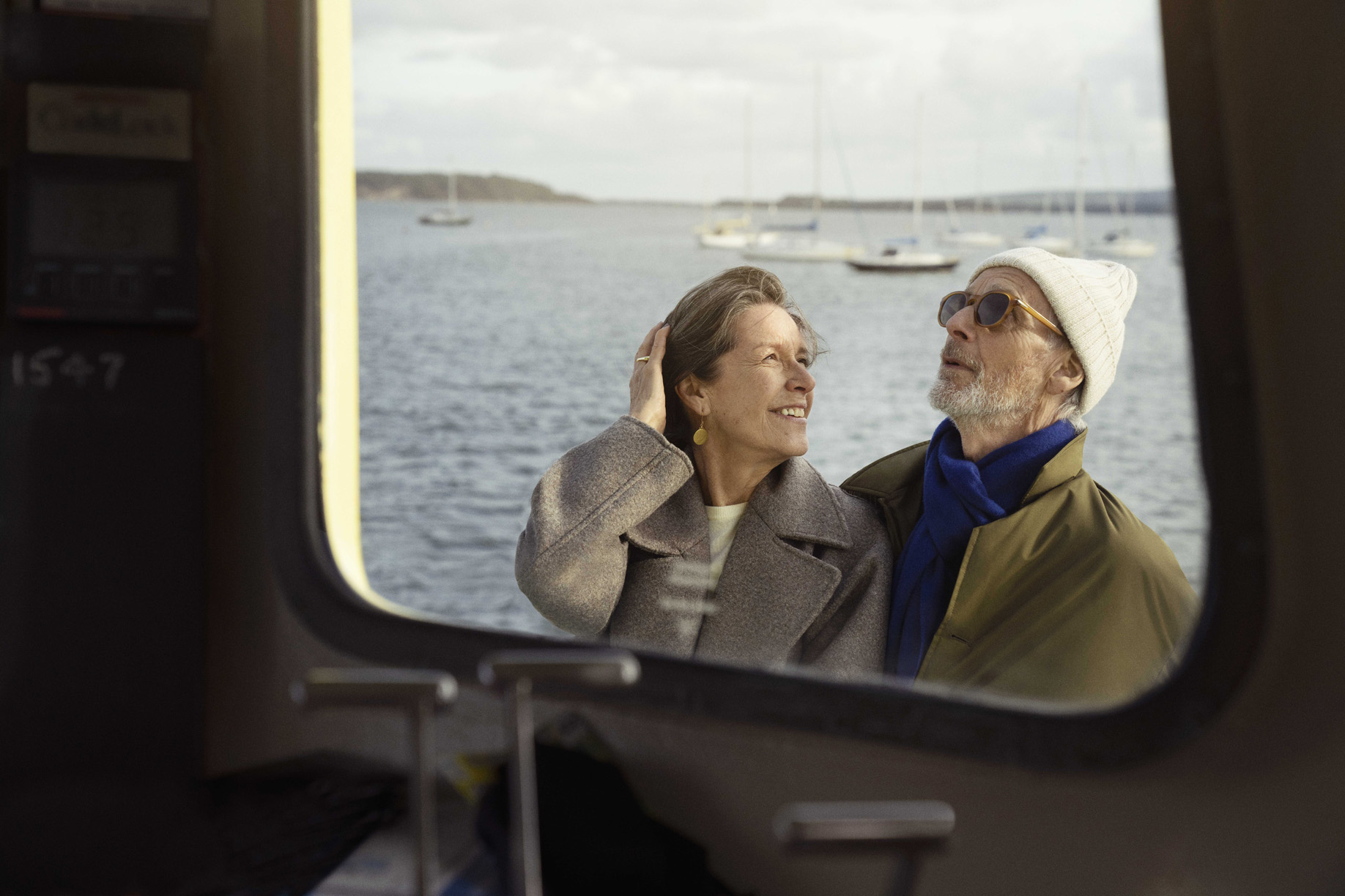 a man and woman sitting in a boat