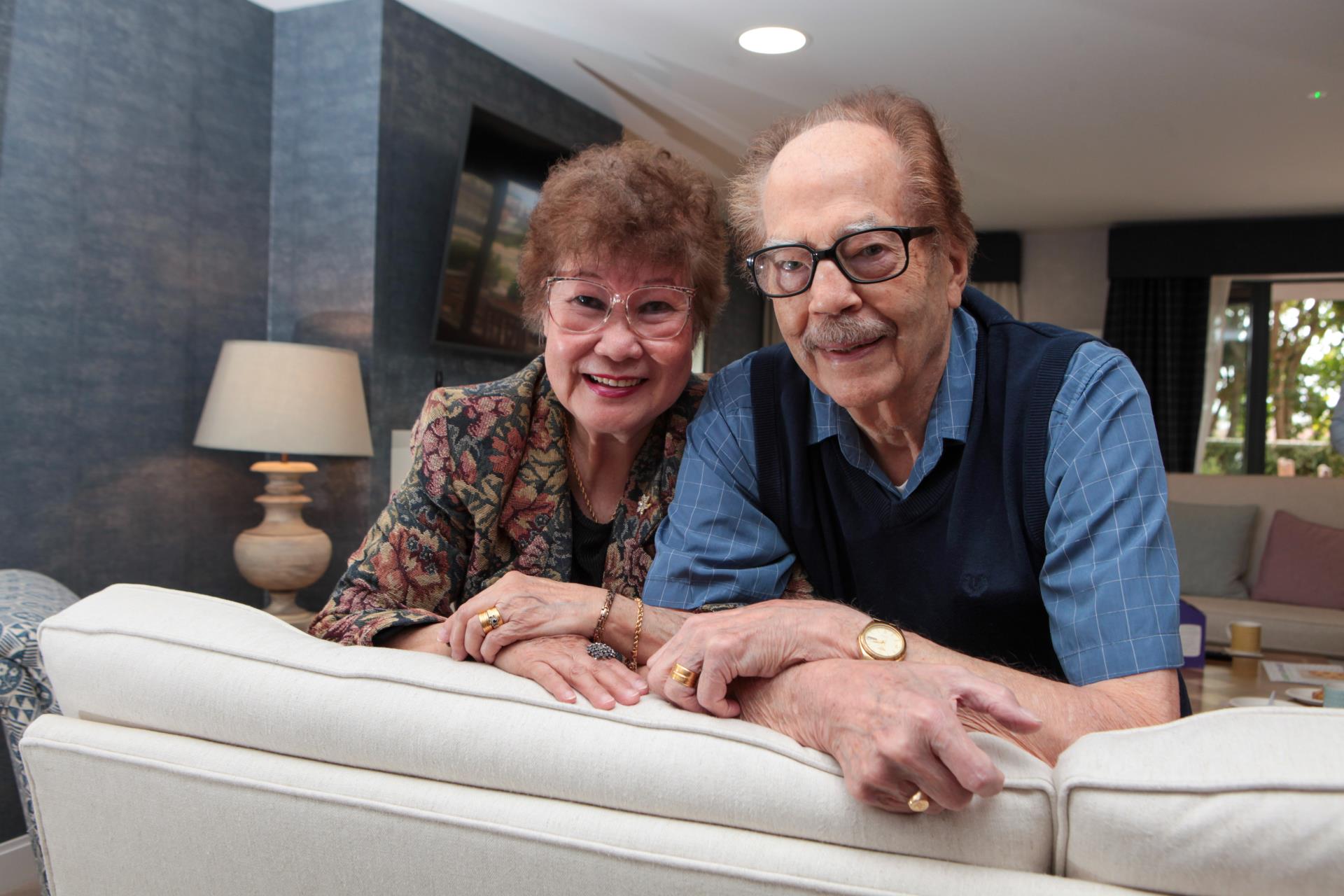 a man and woman sitting on a couch