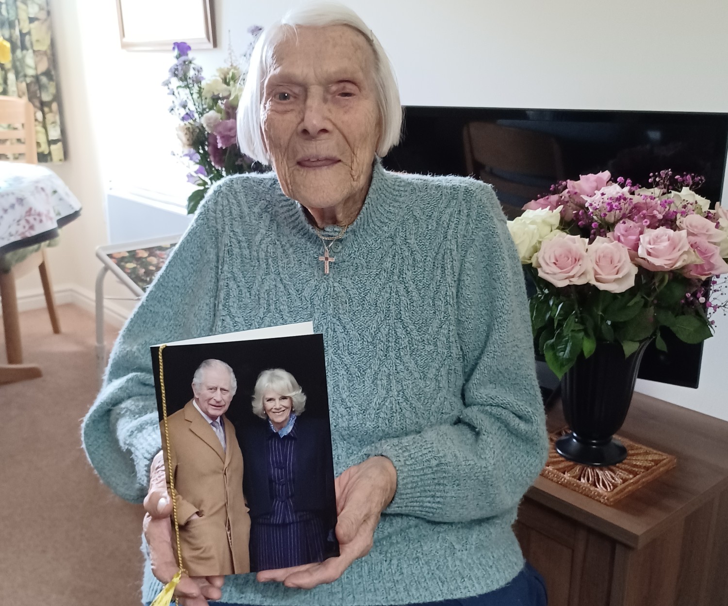 Margaret with her birthday card from the King at her McCarthy Stone retirement property in Wiltshire