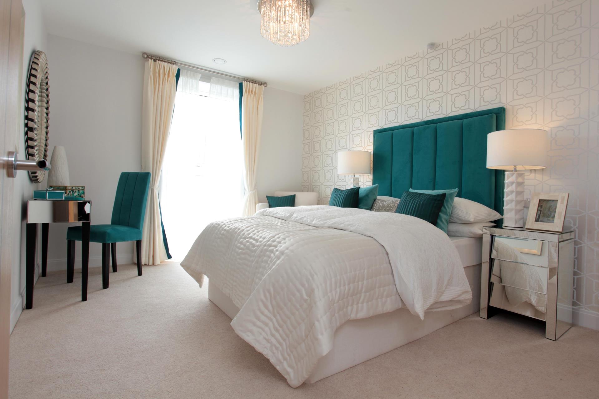 a bedroom with a bed and a chair