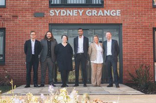 a group of people standing in front of a building