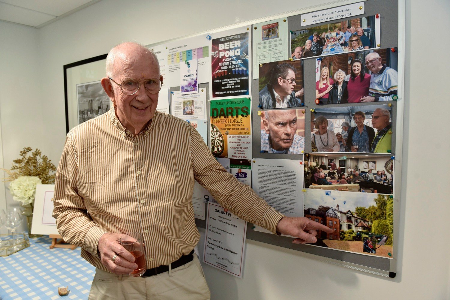 Mike points to and image of his old home from his  McCarthy Stone retirement home in Purley, London