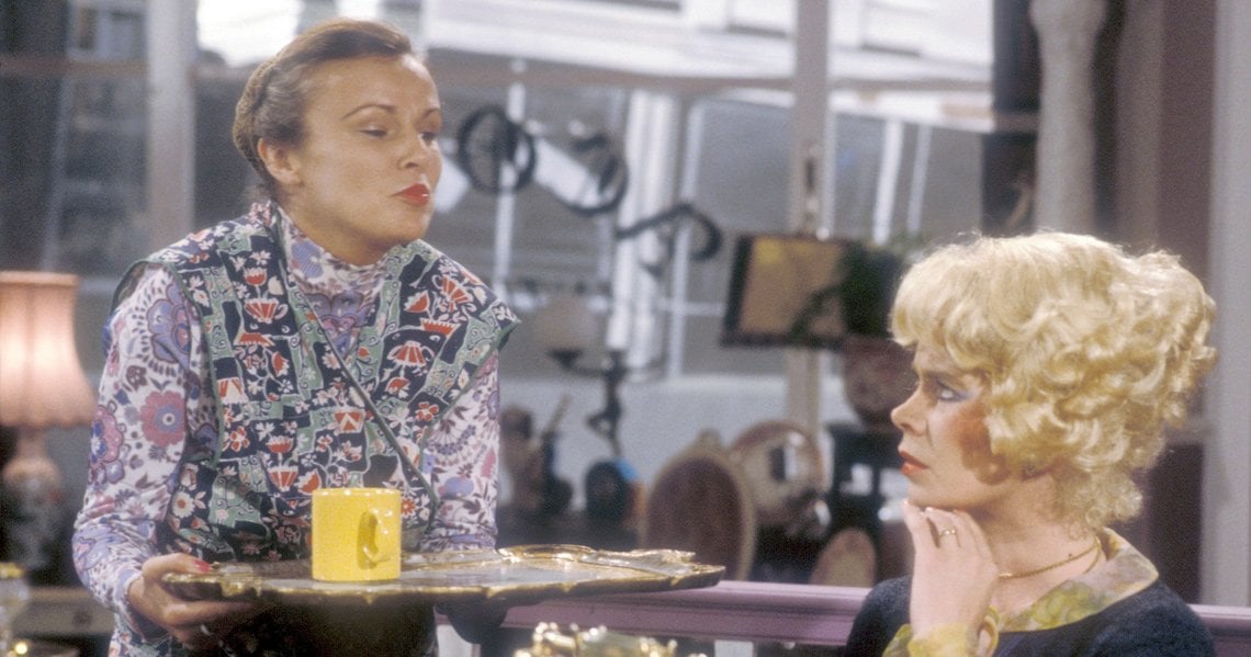 a woman and a man sitting at a table