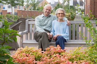 Patricia Flack and her partner Michael Pearson enjoy the garden at Lancer House