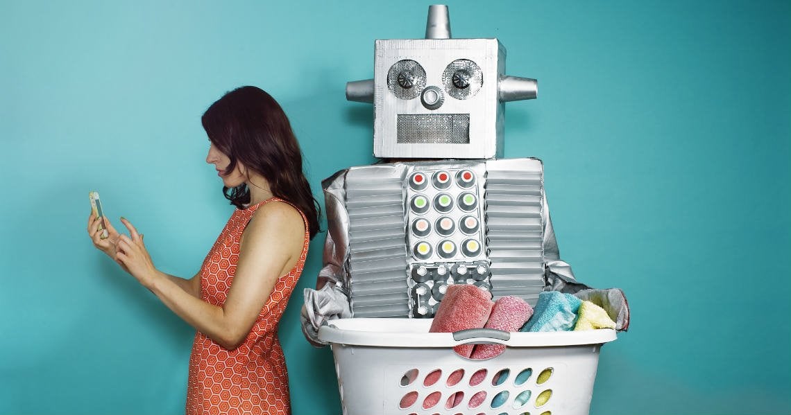 a woman standing next to a machine