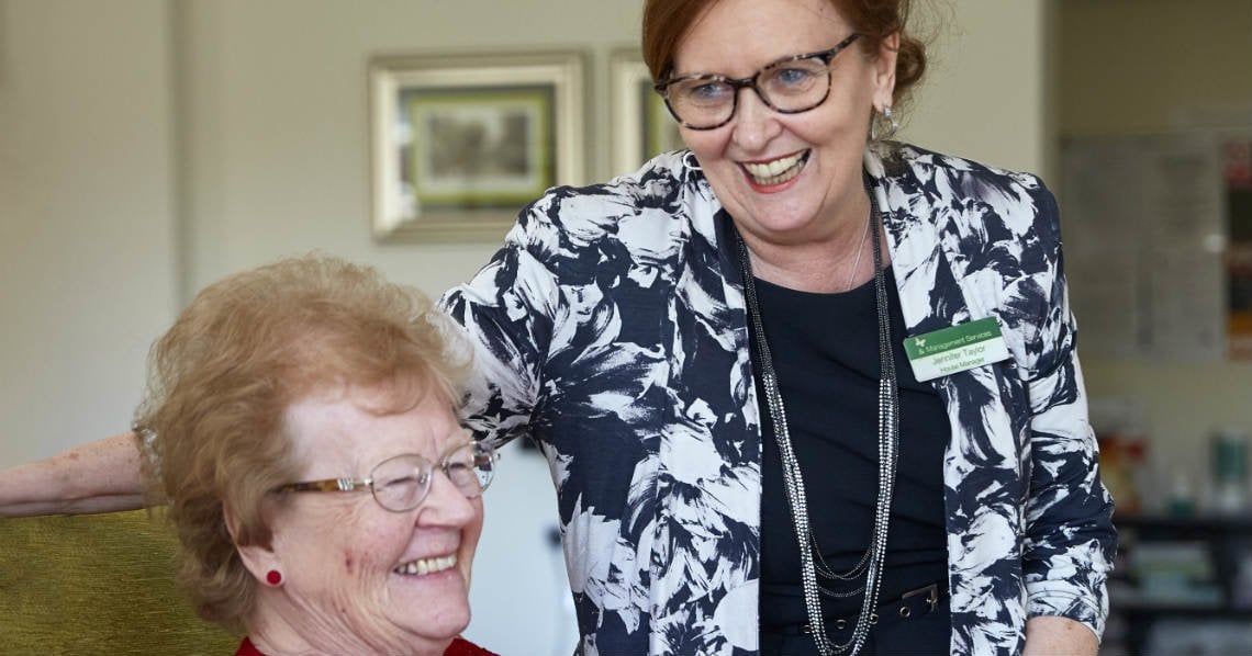 a person smiling next to a person