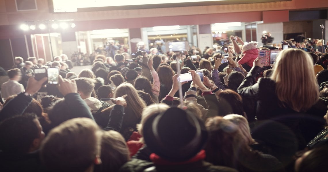a large crowd of people in a room