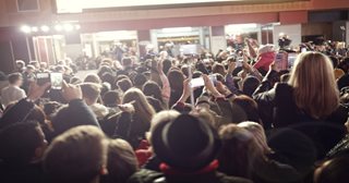 a large crowd of people in a room
