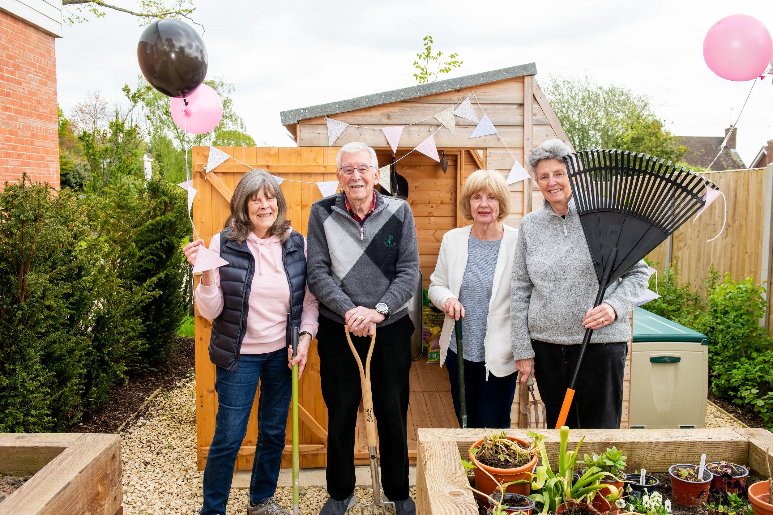 Weavers House homeowners with the new potting shed at their retirement properties in Hawkhurst, East Sussex