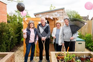 Weavers House homeowners with the new potting shed at their retirement properties in Hawkhurst, East Sussex