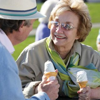 a person holding a glass of beer