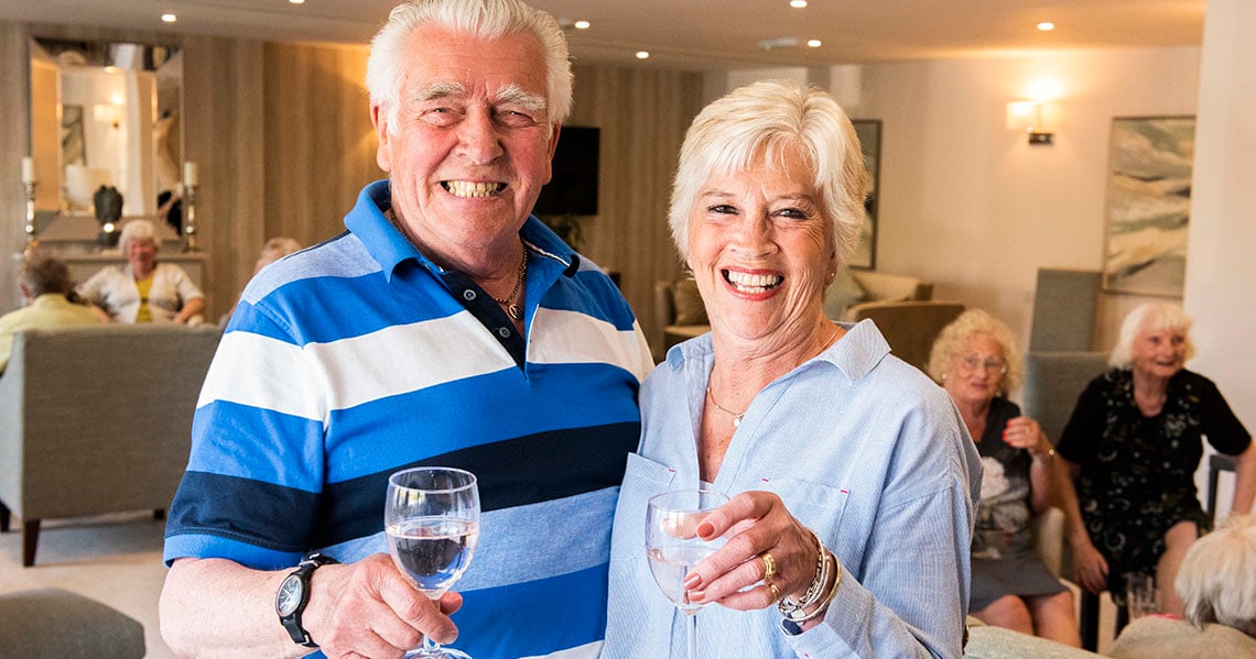 a couple of women holding wine glasses