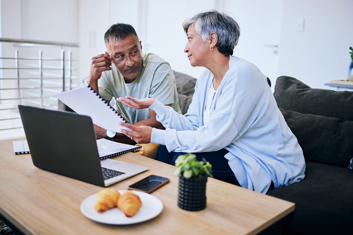 Senior couple of discuss expat benefits and financial planning