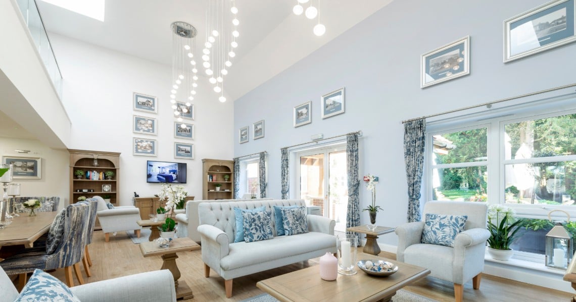 a living room with a white couch and a table