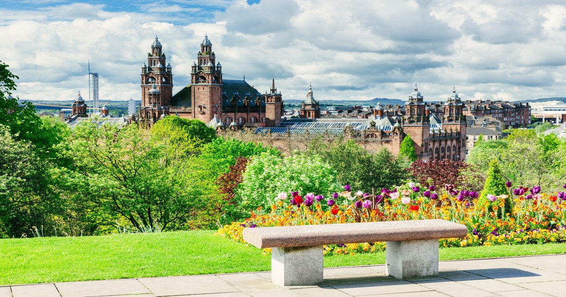 a bench sits in front of a park