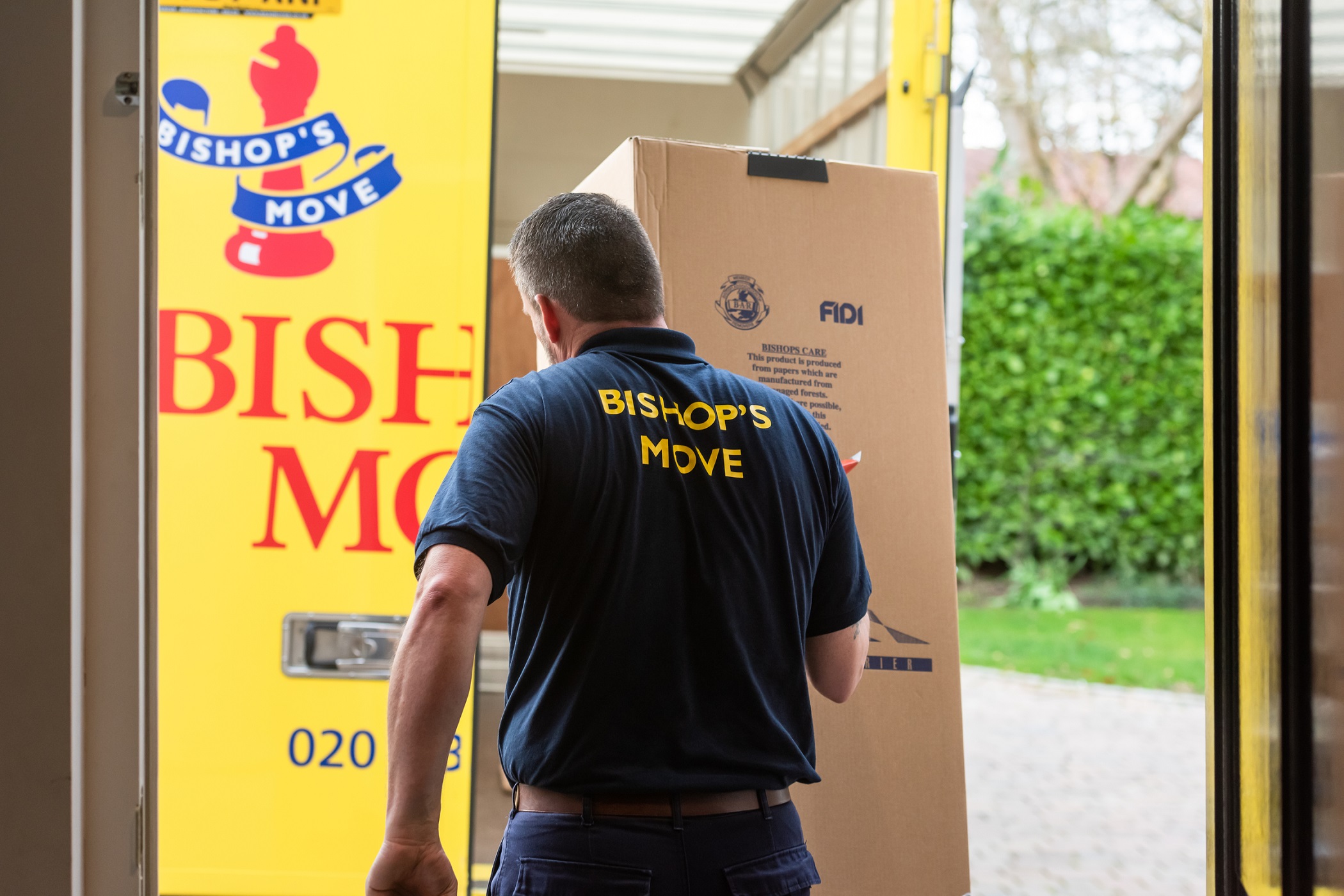Professionals packing up belongings to move from the current home into a rental retirement property