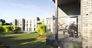 a patio with a chair and a building in the background