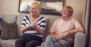 a man and a woman sitting on a couch