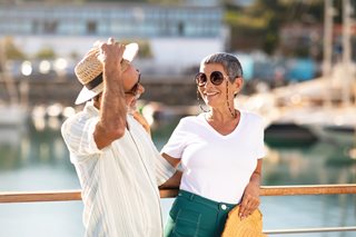Woman and man enjoying time at a marina