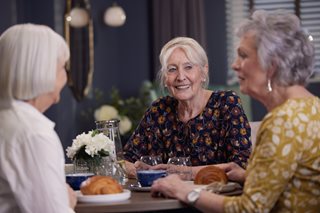 a few women sitting at a table