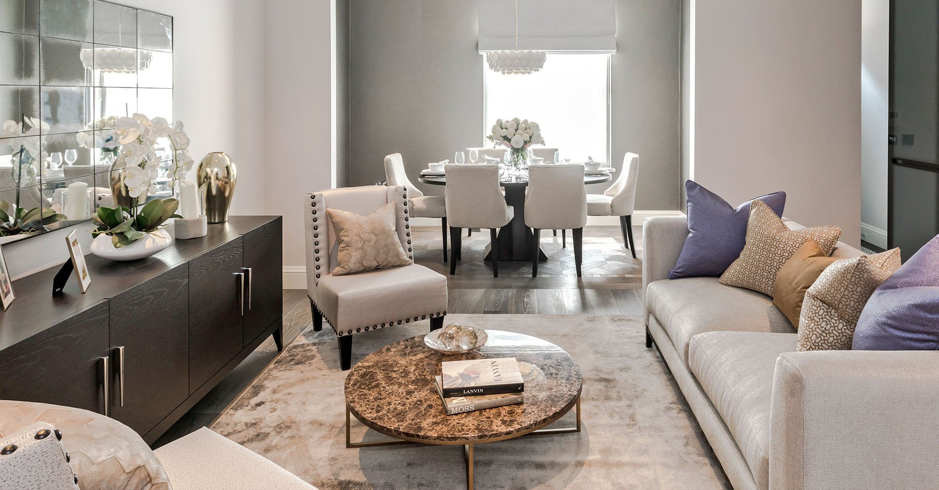 a living room with a table and chairs