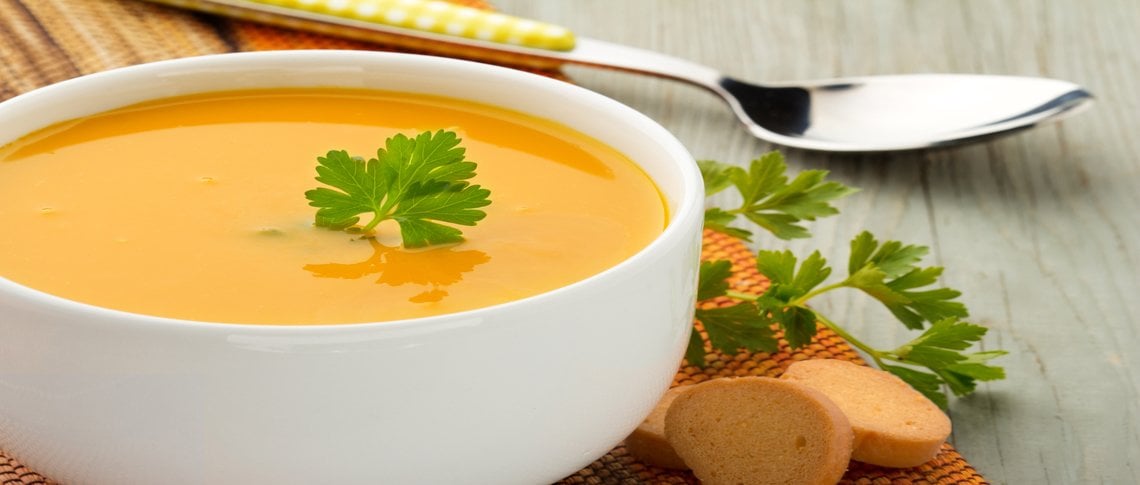 a bowl of soup with a spoon