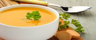 a bowl of soup with a spoon