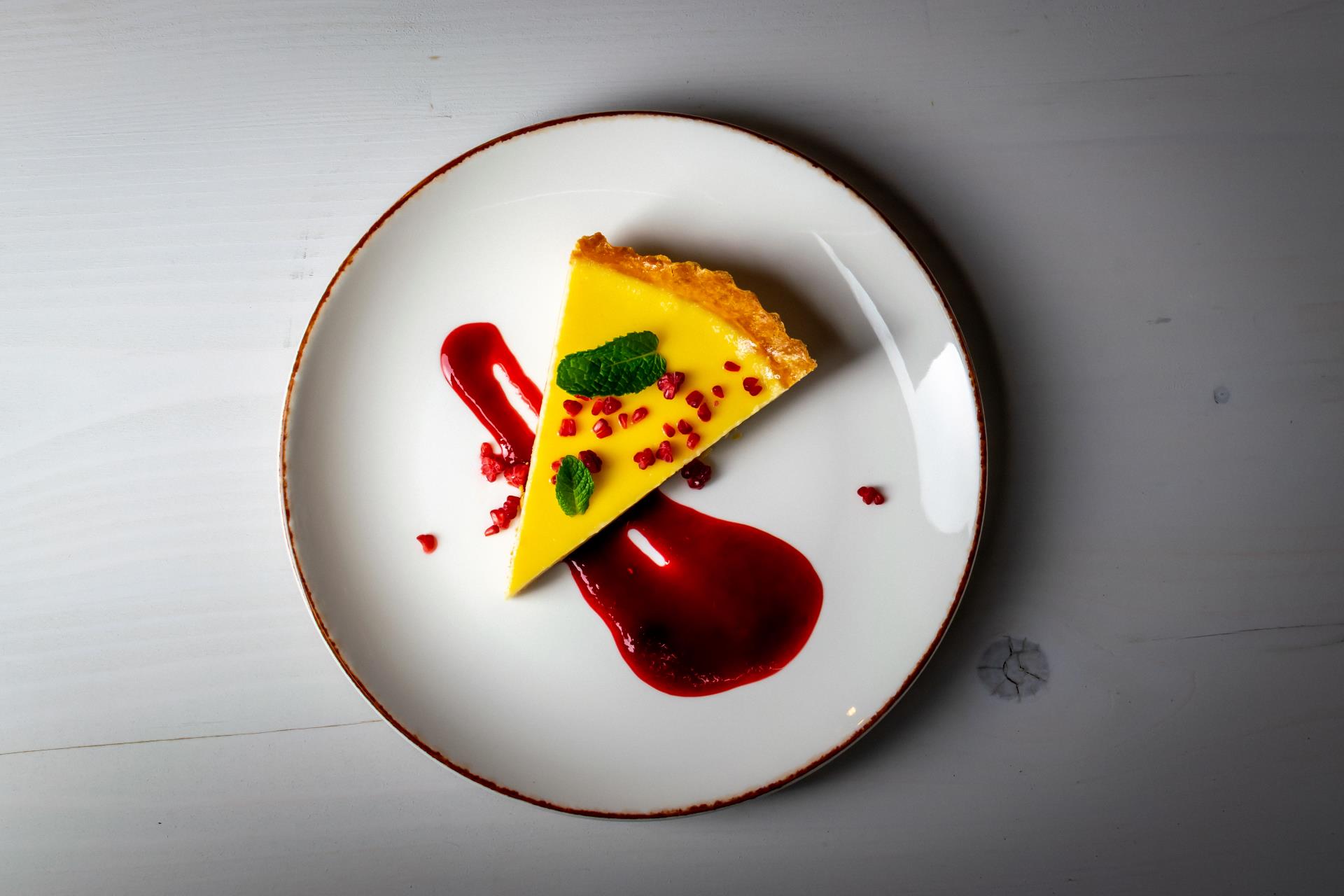 a white plate with a piece of cake on it
