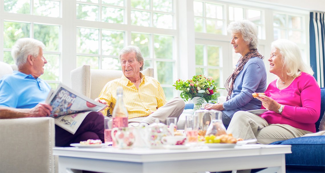 a group of people sitting around a table