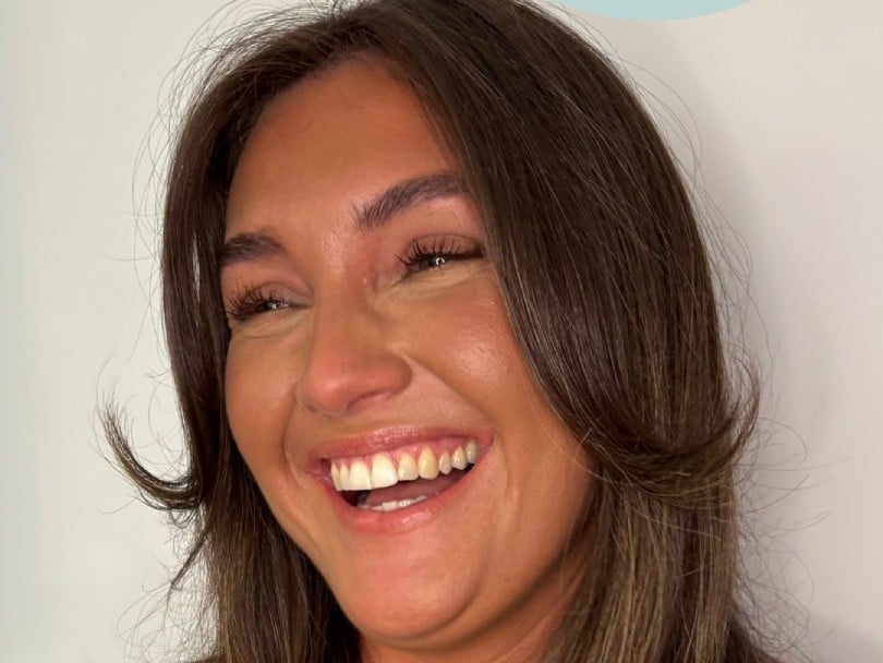 a close-up of a woman smiling