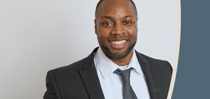 a man in a suit smiling