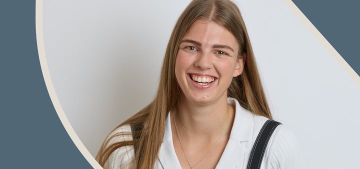 a woman with long hair smiling