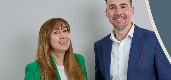 a man and a woman smiling