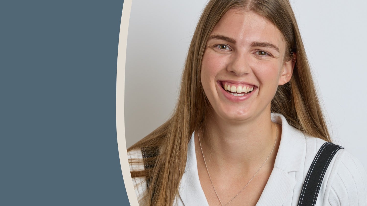 a person with long hair smiling